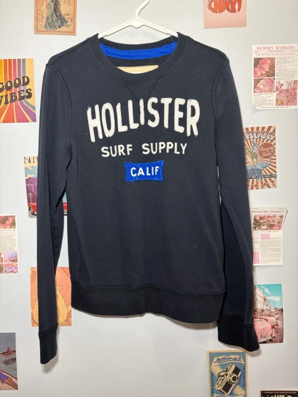 Hollister Black Crewneck Sweatshirt with White Logo and Blue Patch